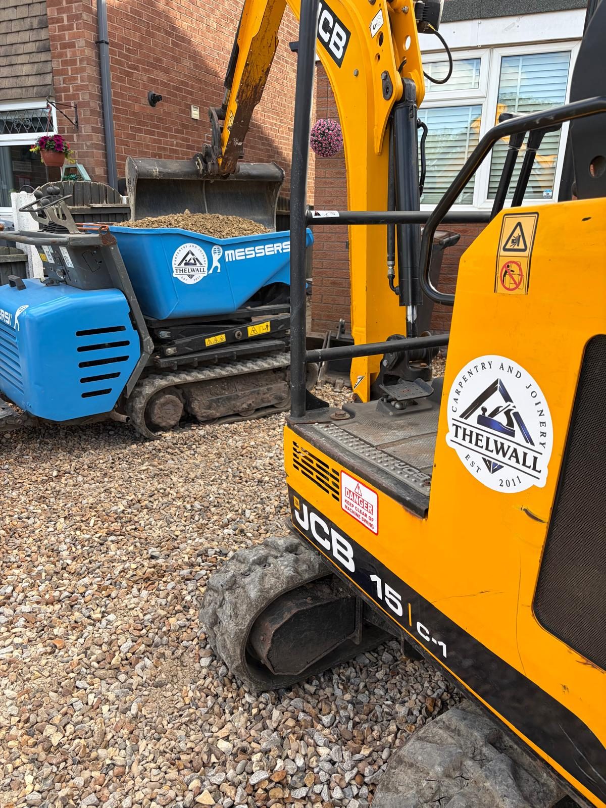 Thelwall's own tracked mini-digger on a prepared gravel site