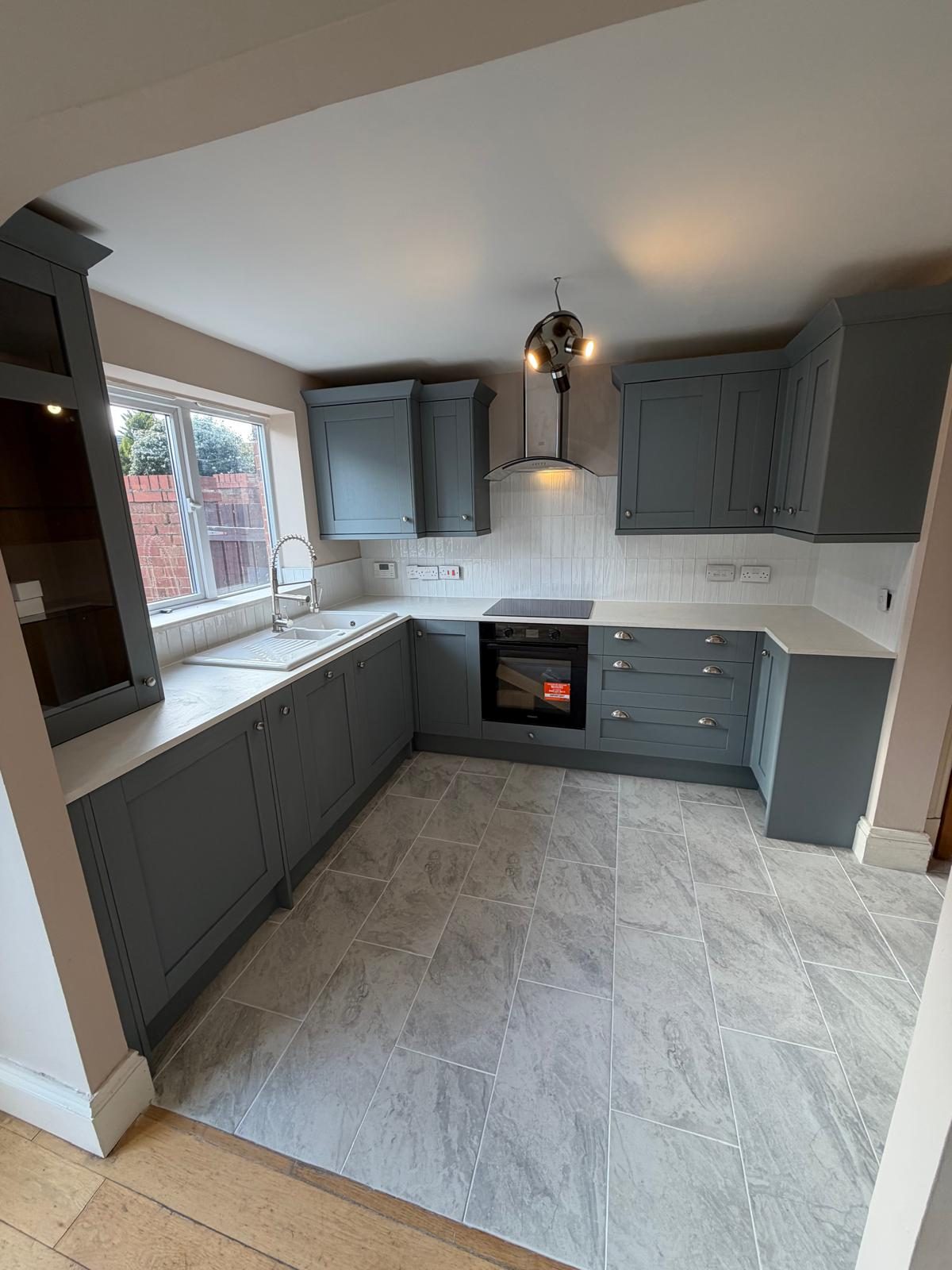 Finished bespoke grey shaker kitchen — full refurbishment